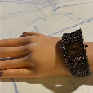 Intricate Black and Brass Filigree Cuff Watch